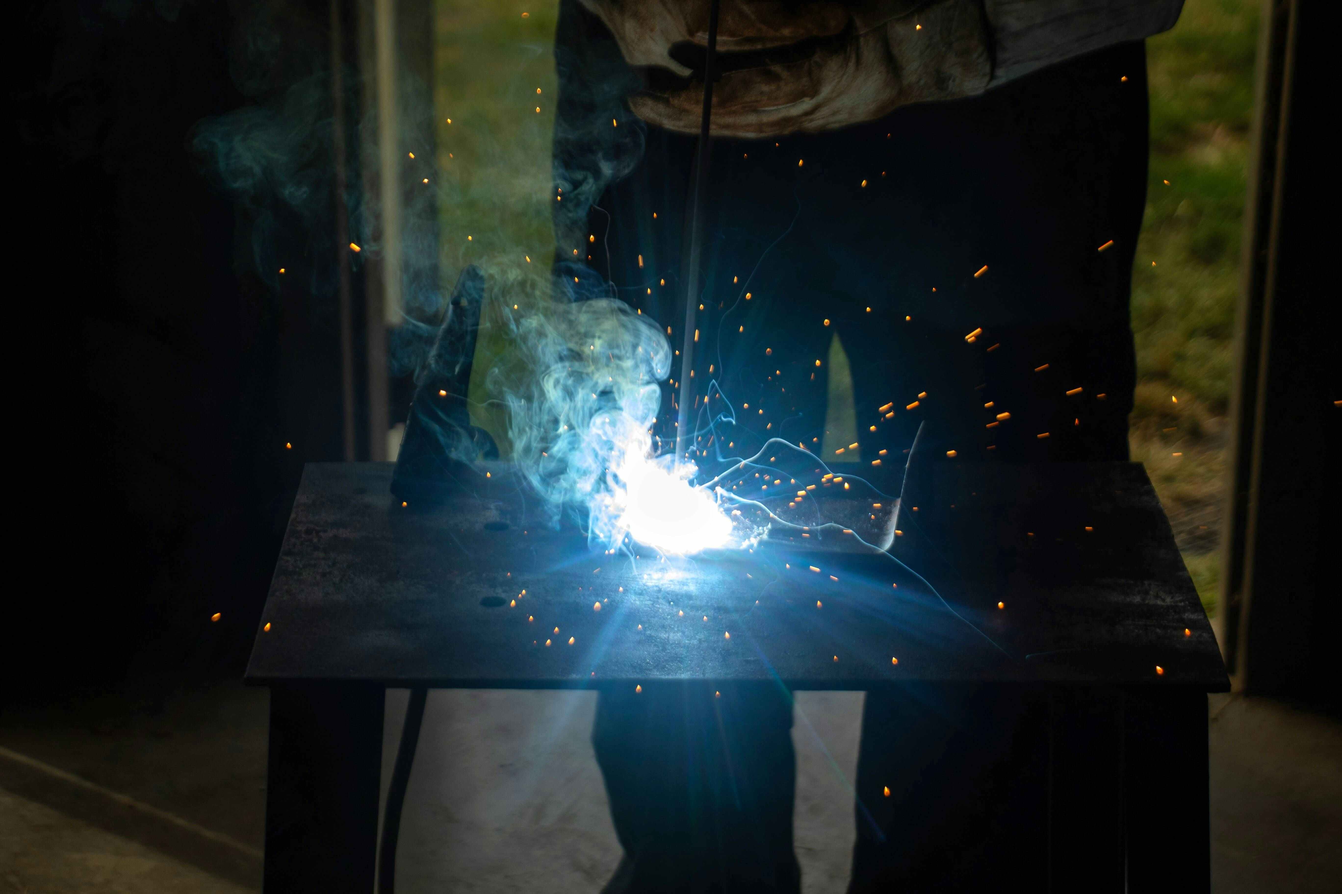 Workshop welding on a bench with nitrogen-supported purge to protect the internal surface.