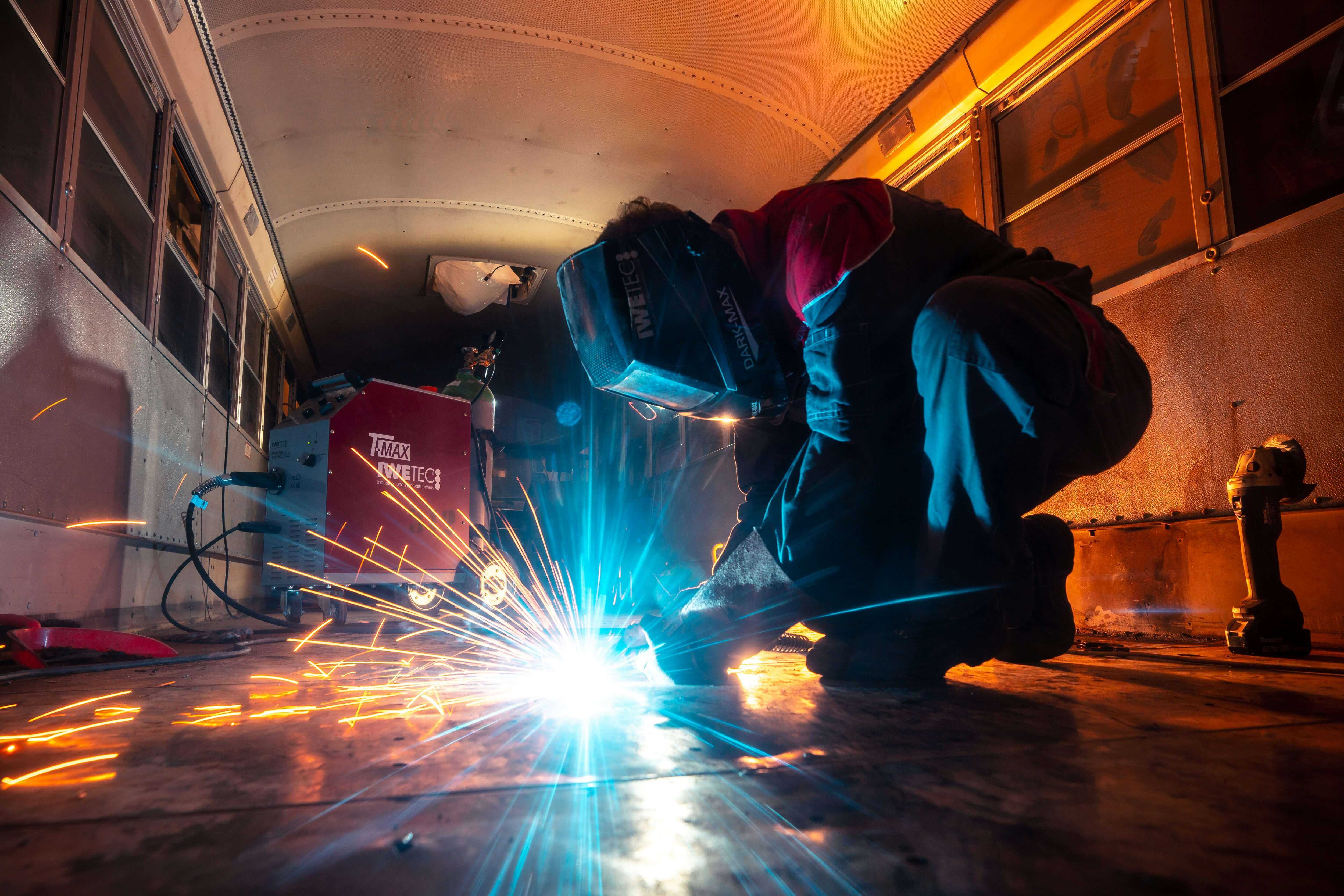 Worker on a rail platform, industrial environment and workwear clothing